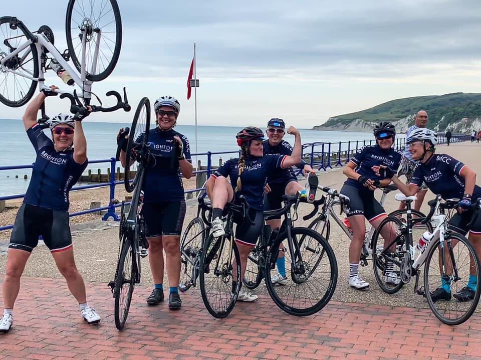 Brighton Mitre cycling club women posing on Eastbourne seafront